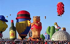 Balloons of all shapes and sizes are inflated and take-off during the Special Shapes Mass Ascension at the Kodak Albuquerque, N.M., International Balloon Fiesta on Friday, Oct. 8, 1999. The fiesta runs through Sunday.