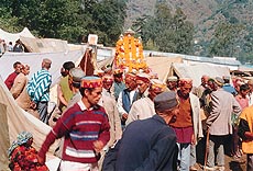 Idols of local gods are carried in palanquins to pay obeisance to Lord Raghunath