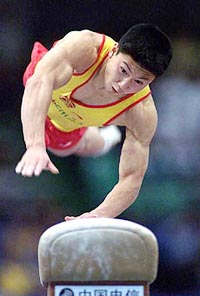 China's Li Xiaoping vaults the horse during men's individual vaulting final of the World Gymnastics Championships in Tianjin, southeast of Beijing, Saturday