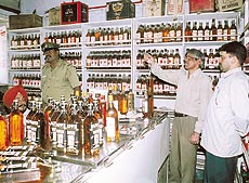 Officials of the UT Excise Department conducting a raid on a liquor vend in Sector 22, Chandigarh, on Saturday