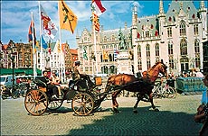 A horse-driven carriage in the Central Square, Brugge