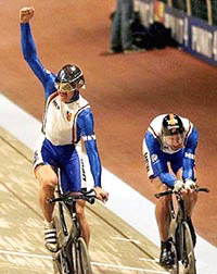 German Robert Bartko, left, celebrates when beating team mate Jens Lehmann in the final of the men's Individual Persuit at the Cycling Track World Championships in Berlin, Germany, on Wednesday