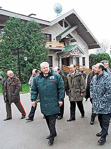 President Boris Yeltsin, center, takes a walk with the ministers he met in his country residence Rus outside in Moscow on Wednesday. 