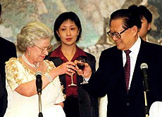 Britain’s Queen Elizabeth II shares a toast with Chinese President Jiang Zemin during the banquet held at the Chinese Embassy in London on Thursday