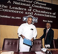 Union Finance Minister Yashwant Sinha and FICCI president Sudhir Jalan at the presidential summit of the Chambers of Commerce and Associations in New Delhi on Saturday .