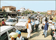 Students of St Stephens School help the police in checking traffic near the school entrance in Chandigarhs Sector 45 on Monday.