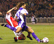 Fiorentina's captain Gabriel Batistuta shoots the winning goal that put Arsenal out of the Champions League during their match at Wembley stadium in London on Wednesday