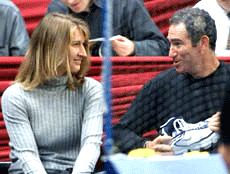 Steffi Graf (left) retired German tennis star, chats with Brad Gilbert, coach of her boyfriend U.S. tennis star Andre Agassi during Agassi's 3rd round match at the ATP tennis tournament in the Hanns Martin Schleyer indoor arena in Stuttgart, Germany, on Wednesday