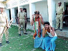 The Bihar police with the help of paramilitary forces giving punishment to booth capturers at booth No. 131, at Bapu Jee Smarak School, Manshi, on Thursday