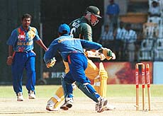 Australian batsman Mark Waugh looks down after being bowled for 32 by Sri Lankan off spinner Muttiah Muralidharan