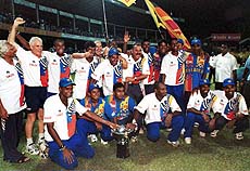 Members of Sri Lanka cricket team celebrate after winning the Aiwa Cup final limited over day-night cricket match at Premdasa Internationl cricket stadium in Colombo on Tuesday