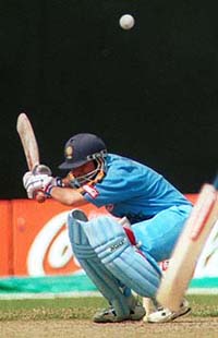 Sachin Tendulkar ducks to avoid a high ball during India's match against West Indies at the Coca-Cola Singapore Challenge on the Singapore Kallang Cricket ground on Tuesda