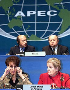 U.S. Trade Representative Charlene Barshefsky adjusts her glasses as State Secretary Madeleine Albright looks on during a joint press conference of the APEC ministers in Auckland on Friday.