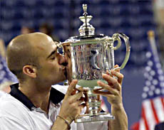 Andre Agassi kisses his winners trophy