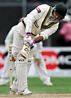 Pakistan batsman Saeed Anwar drives for two runs off West Indies bowler Reon King during cricket action at the Toronto Cricket Festival in Toronto on Thursday