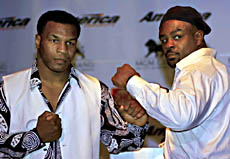  Boxers Mike Tyson (left) and Orlin Norris pose for photographers after a news conference in Las Vegas on Thursday, to announce their heavyweight fight which is scheduled for October 23