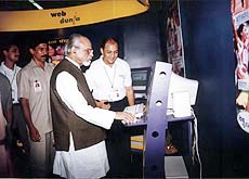 former Prime Minister I.K. Gujral inaugurating the first Hindi postal "webdunia.com" at Pragati Maidan in New Delhi on Thursday