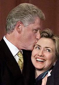 First lady Hillary Rodham Clinton gets a kiss from President Clinton