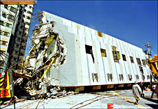 A building that collapsed at Minchien in Taichung county after a massive aftershock measuring 6.8 on the Richter scale hit Taiwan on Sunday