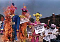 Anti-Terrorist Forum chief M.S. Bitta putting on fire the effigies of Osma-bin-Laden and leaders of Pakistan and Afghanistan in protest against their terrorist activities in front of Red Fort in Delhi on Sunday