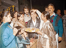 The mother of Rakesh applies a tilak on her son’s forehead as she welcomes him and Pooja, his wife, after they returned to the city from New Delhi late this evening after a week-long aeroplane hijack ordeal.