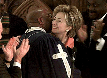 US First Lady Hillary Rodham Clinton is greeted by the Rev. Reginald Williams of the Charity Baptist Church before delivering her speech at the Convent Avenue Baptist Church’s Martin Luther King Jr. celeration function on Monday in New York