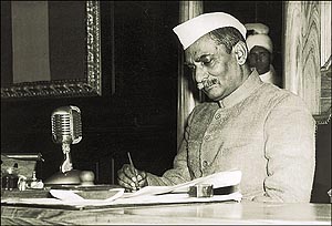 Dr Rajendra Prasad, President of the Constituent Assembly, signs the new Constitution of the Indian Republic. 