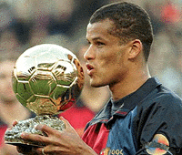 Barcelona's Brazilian stiker Rivaldo kisses the Golden Ball award he recieved from France's prestigious football magazine France Football in Barcelona's Camp Nou stadium. Rivaldo won the Golden Ball player of the year award last December but was presented the trophy on Sunday