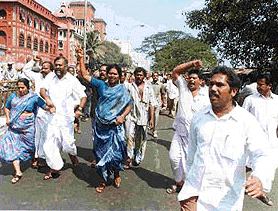 AIADMK members shouting slogans and blocking traffic near the Special Court Complex in Chennai on Wednesday to protest a special court verdict convicting their leader Jayalalitha's in a corruption case in Chennai on Wednesday. — PTI
