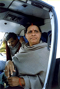 Bihar Chief Minister Rabri Devi accompanied by CPM leader Sitaram Yechuri boarding a chopper at Patna airport to campaign for her RJD candidates in the forthcoming elections