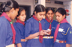 Guides of Government High School, Kumbra, SAS Nagar, present a group song at the Scouts and Guides Day celebrations on the school premises on Tuesday.