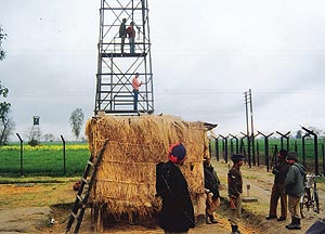 Indian security personnel maintain a round-the-clock vigil on the Indo-Pak border