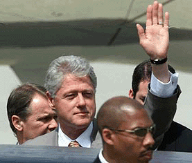 President Clinton waves on his arrival at a Pakistan Air Force base in Islamabad on Saturday. He was in the country for a brief visit.