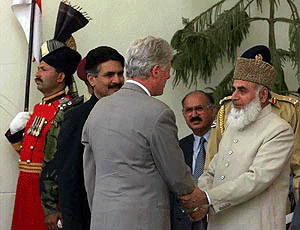 U.S. President Bill Clinton is greeted by Pakistani President Rafiq Tarar at the Presidency Building in Islamabad on Saturday.