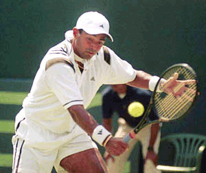 Leander Paes of India making a backhand return against Yongil Yoon of South Korea in the first singles of the Davis Cup Asia Oceania group 1 second round match in New Delhi on Friday