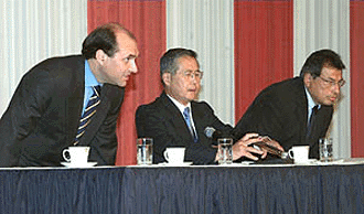 Peruvian President Alberto fujimori (centre), and running mates Francisco Tudela (left) and Ricardo Marquez attend a press conference in Lima on Monday, a day after the general election. Fujimori has 49 per cent of the vote, according to the latest official results. His opponent Alejandro Toledo has 38 per cent. The results will force a second round of elections