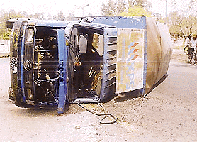 A speeding Canter overturned near the Hallo Majra roundabout in Chandigarh on Wednesday. Two of its occupants were injured. — Tribune photo by Parvesh Chauhan