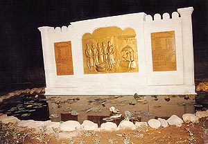 Relief panel showing a detail of the Sikh Panth and the symbolic lotus pond