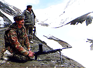 Army personnel maintaining tight vigil on the snow-covered mountains on Srinagar-Kargil highway which was thrown open to traffic after remaining closed for about four months on Friday