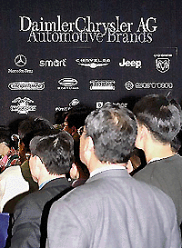 South Korean watch auto makers compete with one another to take over ailing Daewoo Motors Co., in Seoul on Thursday. — AFP