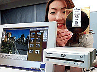Matsushita Electric unveils a DVD-Ram disc drive LF-D200JD and its 9.4-giga byte DVD-Ram disc which can store data on both sides of the disc at a press preview in Tokyo on Monday.  AFP