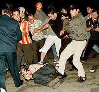 Rival soccer fans fight in central Copenhagen late Tuesday evening, where running battles developed between fans of Galatasaray, Istanbul and Arsenal, London