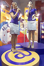 Two sales models introduce Thailands latest Internet service provider (ISP), CS Internet, during the opening day of e-Expo 2000, a three-day exhibition on Thailands Internet technology.  AFP