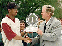 Tiger Woods (left) of Windermere, Fla., receives the Memorial Tournament trophy from Jack Nicklaus after Woods finished with a 19-under-par 269 on Monday