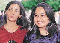 Tainted eyes: Two city youngsters sporting coloured lenses which are increasingly becoming a rage in the city.  Tribune photo by Parvesh Chauhan