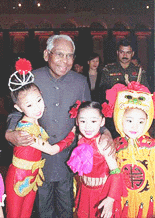 President K. R. Narayanan embrassing young Chinese dancers after a cultural show at Dallan in China on Wednesday