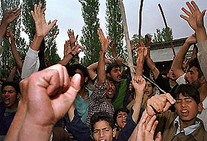 Kashmiri Shiite Muslims protest against he killings at Bemina area on the outskirts of Srinagar on Sunday. At least 12 Shiite Muslims were killed and 15 wounded when a powerful bomb exploded near a religious gathering at Gund Qasim village in north Kashmir, wounding a prominent Shiite leader, Moulana Lftikhar Hussain Ansari.