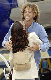 Tennis player Gustavo Kuerten, is greeted upon arrival in his native Florianopolis, Brazil, on Tuesday 