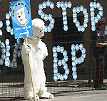 A protester dressed as a polar bear stands outside the World Petroleum Congress barricade where stickers were placed on Tuesday in Calgary in protest of BPs Arctic drilling. 