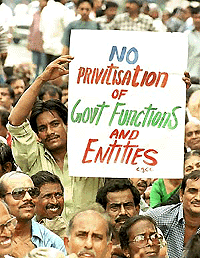 A government employee holds a poster during a protest rally against privatisation in Calcutta on Wednesday. Nearly 1,000 employees joined the rally to protest against moves to downsize government departments and privatise state-owned companies.  Reuters